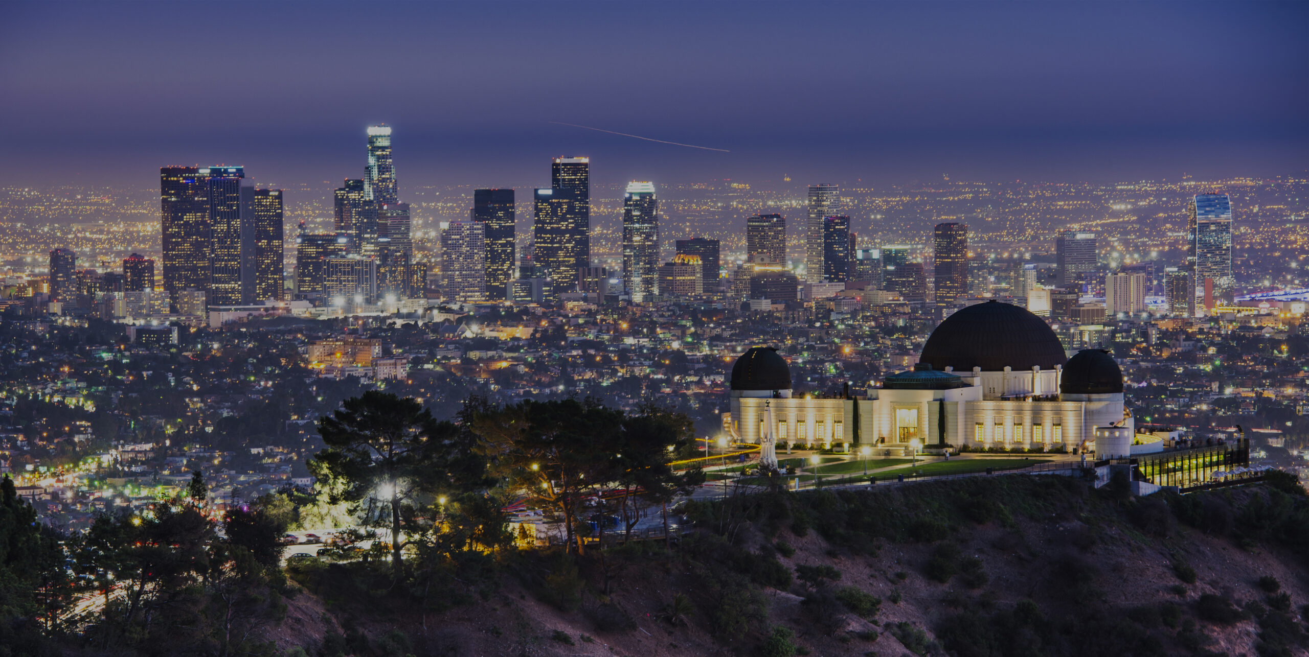 Griffith Obervatory and Downtown Los Angeles, California, USA skyline at dawn.